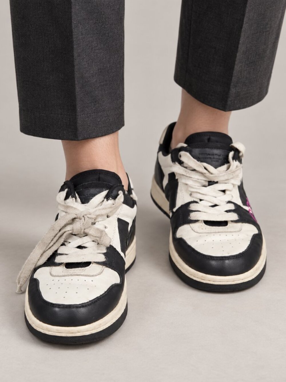 Black and White Low-Top Sneakers with Pink Accent